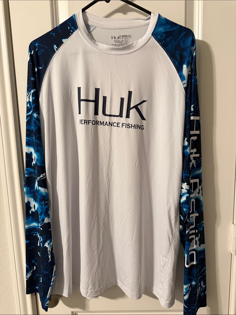 Huk Men’s White Long-Sleeve Performance Shirt with Blue Sleeve Pattern